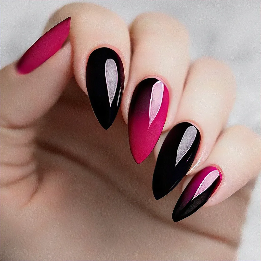 Black and pink, holiday-themed classic stiletto nails. Ombre techniques perfect for light skin tones.