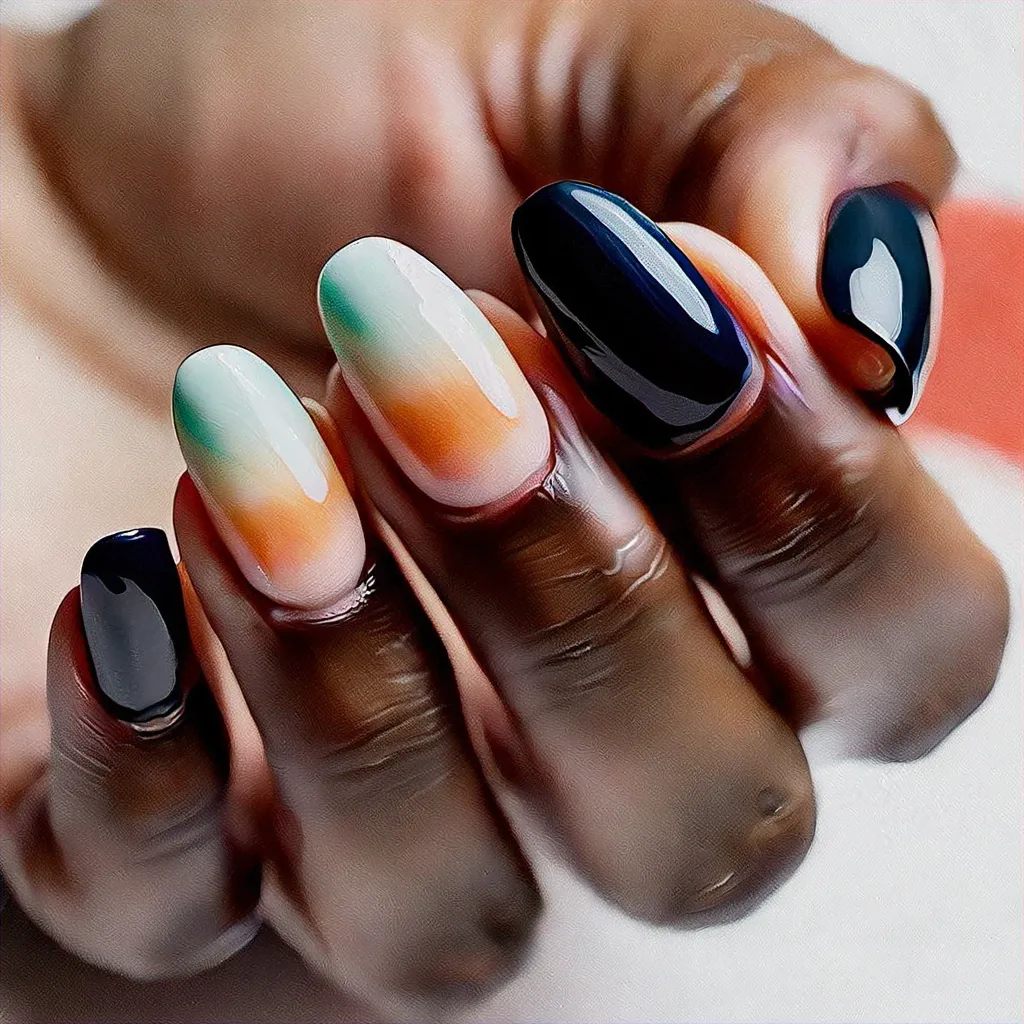 Flaunt a fall mermaid style with an intriguing black and white dip on your oval-shaped nails, perfect for deep skin tones.