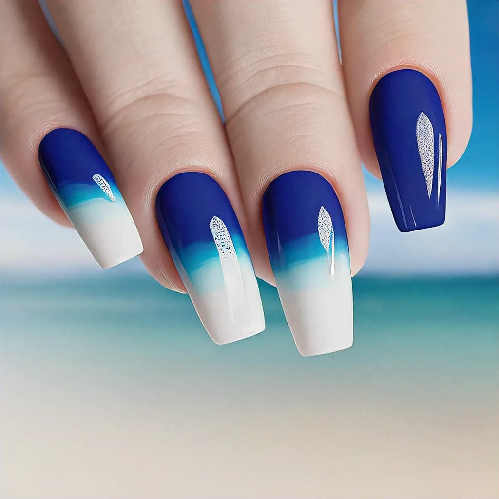 Fair skin toned? Opt for a vacation-themed, blue & white, airbrush style on coffin-shaped, small nails.