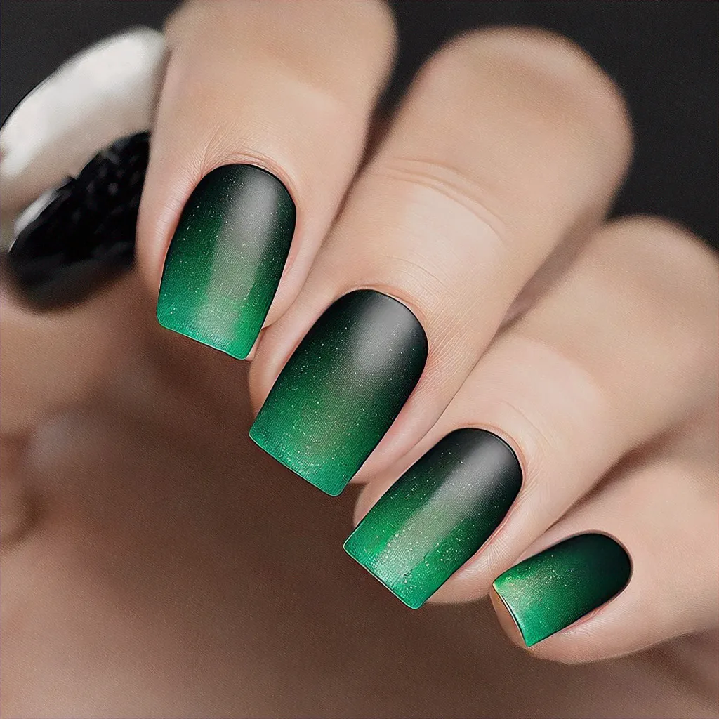 Green-black square nails, unique celebration-theme style, deep skin tone, using ombre dip powder technique.