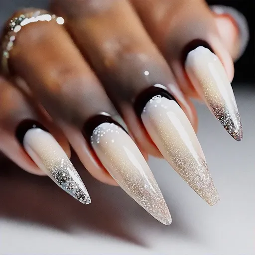Deep skin tone foil stiletto nails in brown. Styled with winter-themed ombre dip powder technique.
