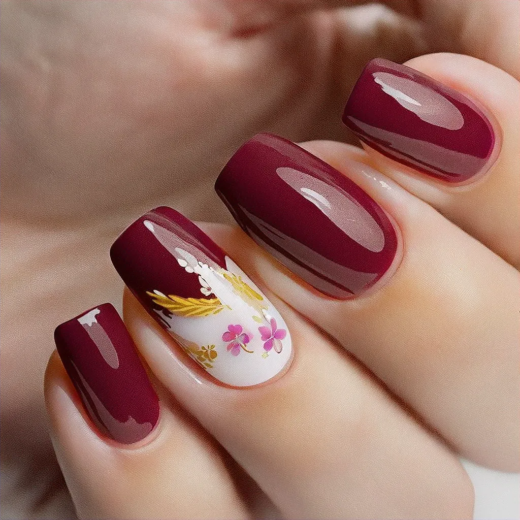 Celebrate in style with oval-shaped, burgundy-colored nails, beautifully theme-themed with a Hawaiian twist. Perfectly for medium-olive skin.