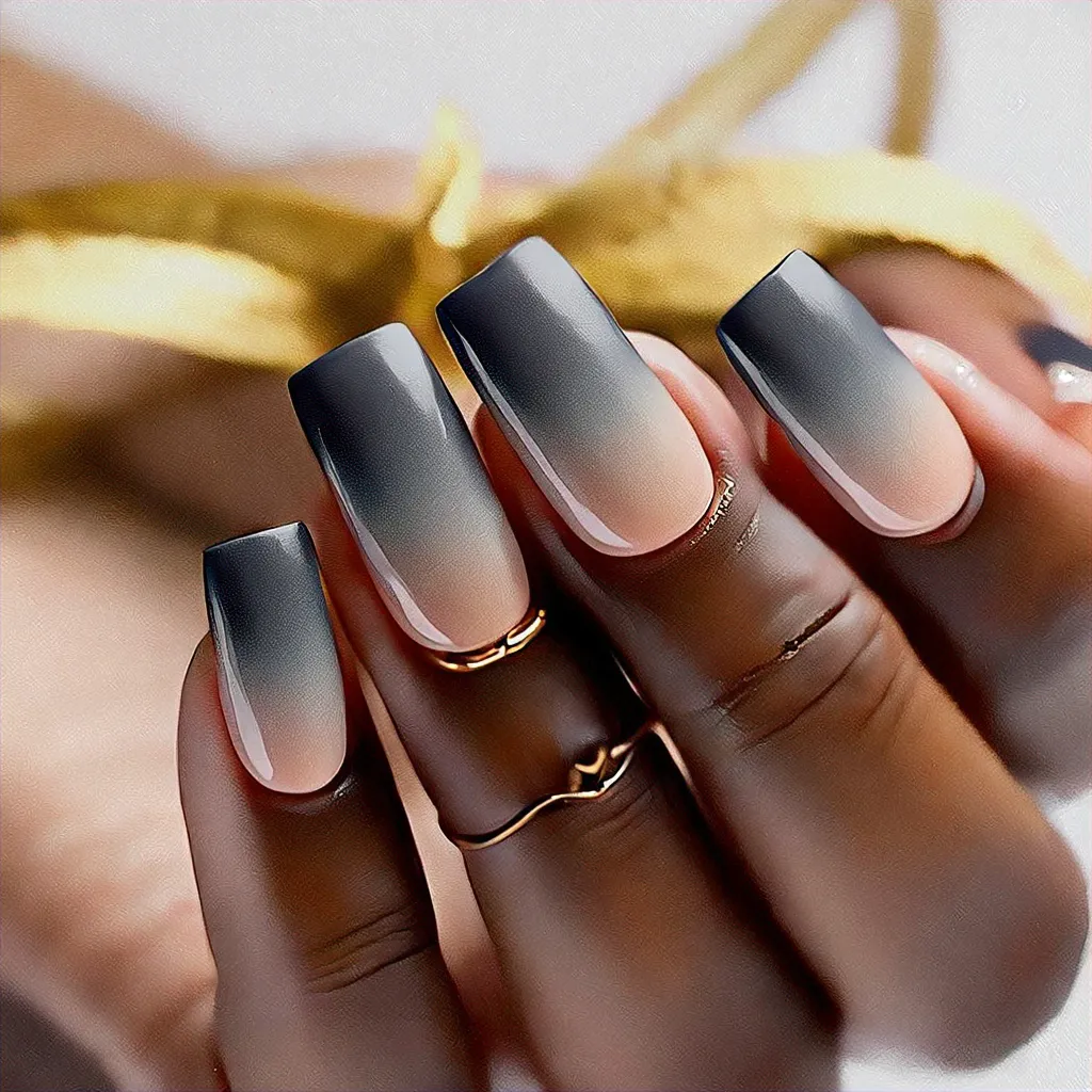 Featuring grey ombre dip powder on square-shaped nails for deep skin tones, promoting a unique celebration theme.