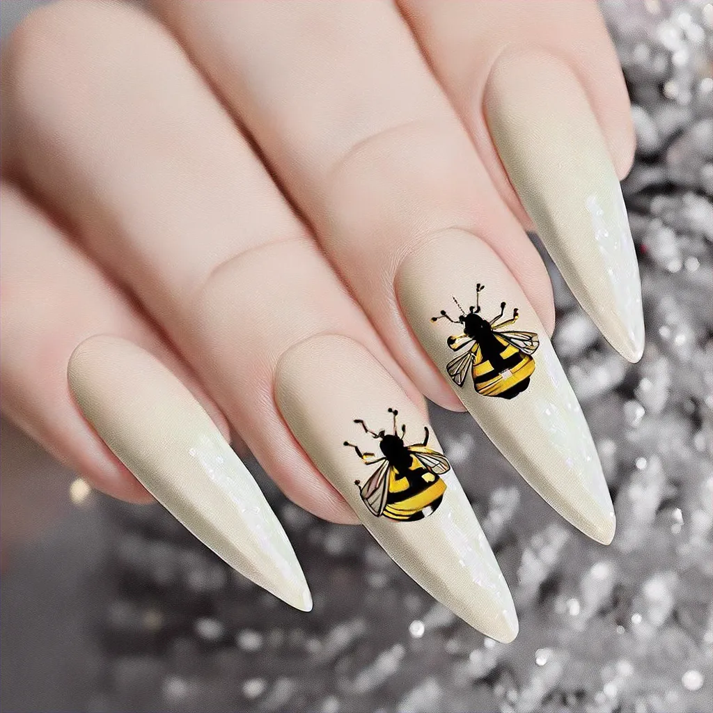 Fair-skinned? Try a Christmas-themed nail art! Opt for a stiletto shape with beige bee french tips!