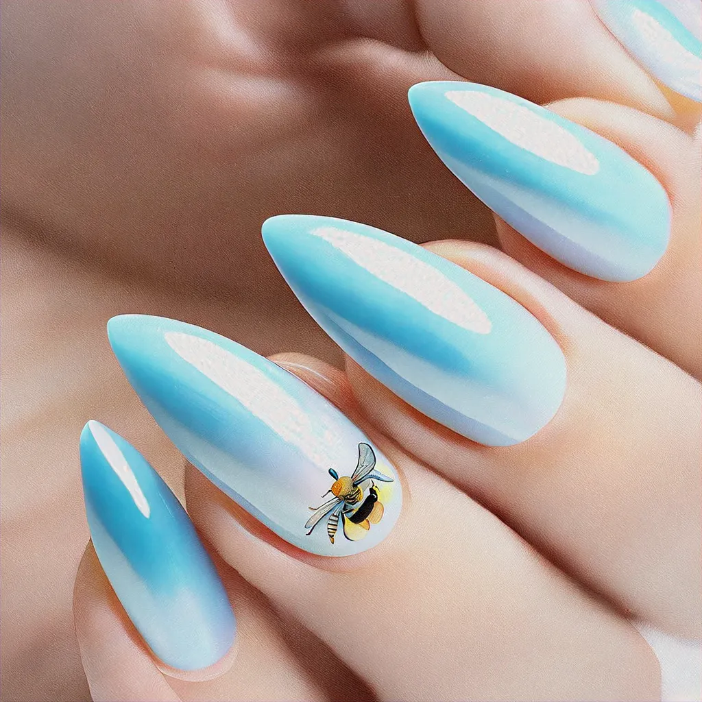 A light blue, holiday-themed bee style on stiletto-shaped nails. Perfect for light skin tones. Techniques used: cat eye.
