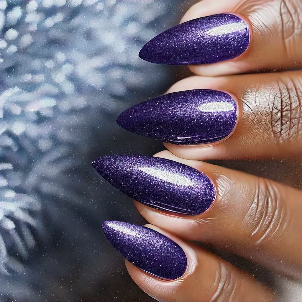 Light purple, swirl-patterned, stiletto shaped winter-themed nails, conveying elegance. Ideal for deep skin tones.