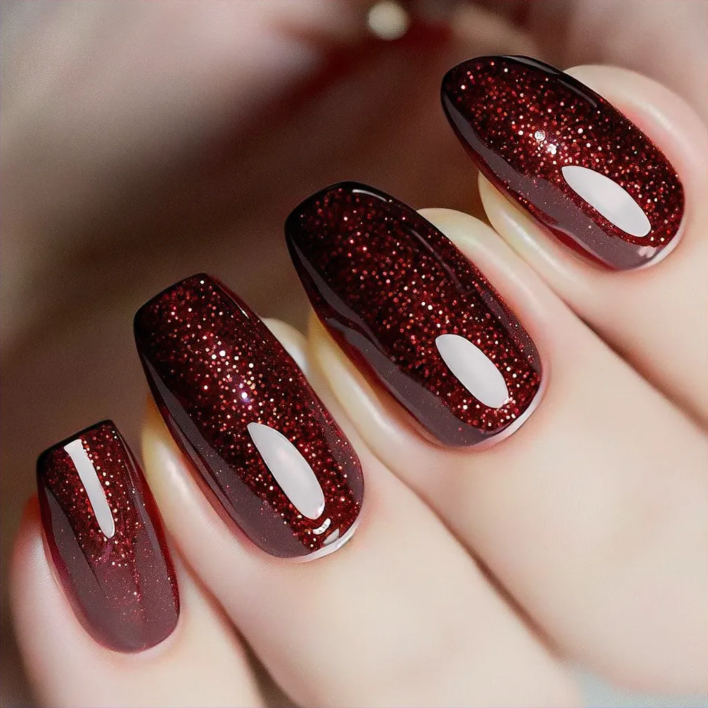 Fun cruise-themed maroon almond-shaped nails glittering beautifully on light skin tones.