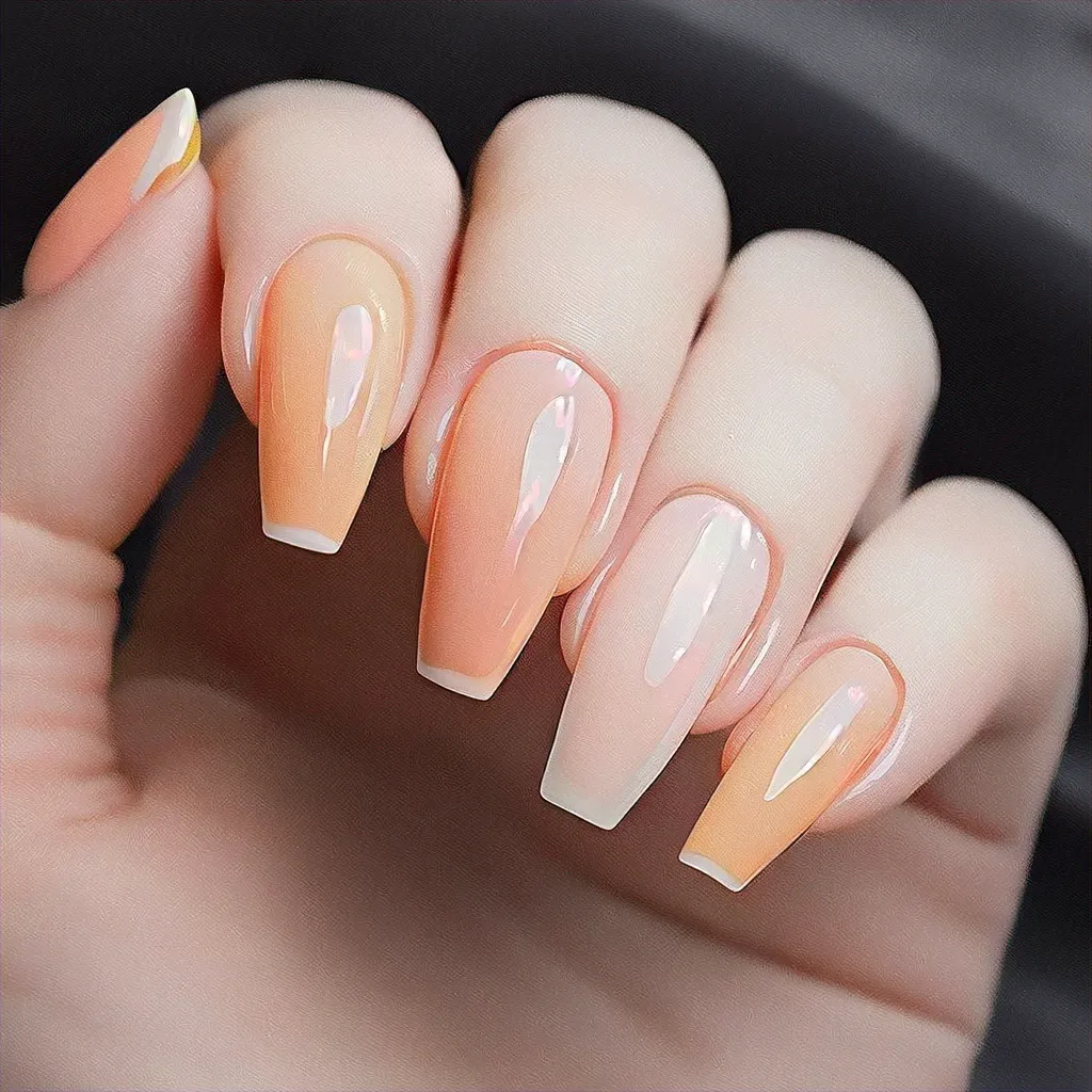 Sink into vacation mood with this peach-themed, neutral coffin-shaped french tip design ideal for fair skin.