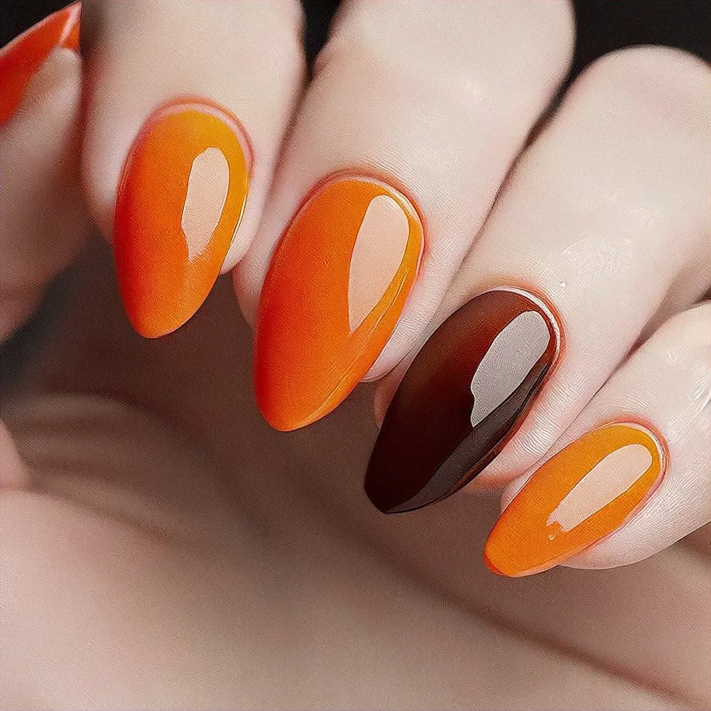 Featuring a unique, ugly style for a daring look. Deep skin tone meets fall-themed, orange oval dip nails.