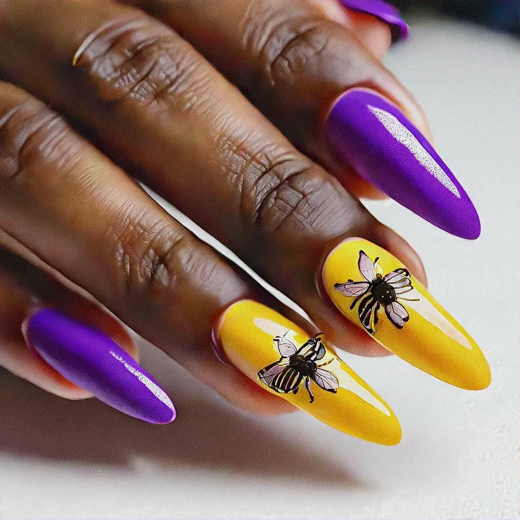 Medium-olive toned stiletto nails with a summer bee theme, colored in a beautiful purple using powder dip technique.