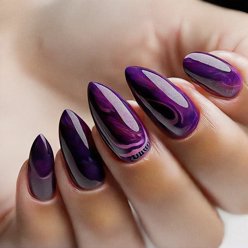 Deep-toned skin perfectly complements a boho-themed purple swirl on almond-shaped nails. Ideal for Thanksgiving.