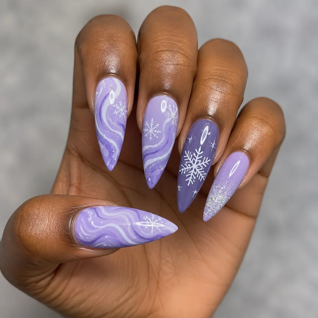 Light purple, swirl-patterned, stiletto shaped winter-themed nails, conveying elegance. Ideal for deep skin tones.
