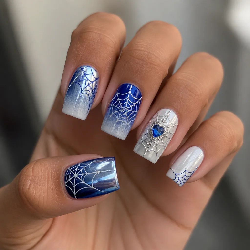 Medium-olive skin contrasts stunningly with a wedding-themed, blue and white chrome spider web on square nails.
